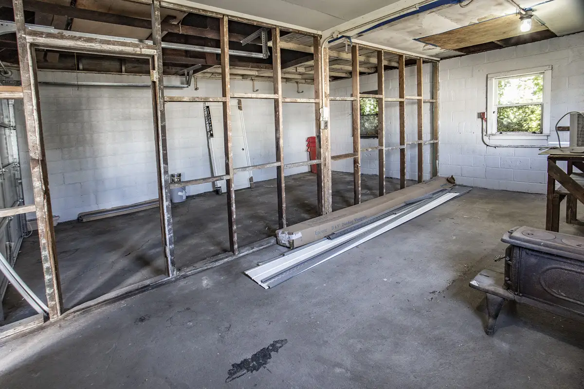 Early building photo showing wall studs