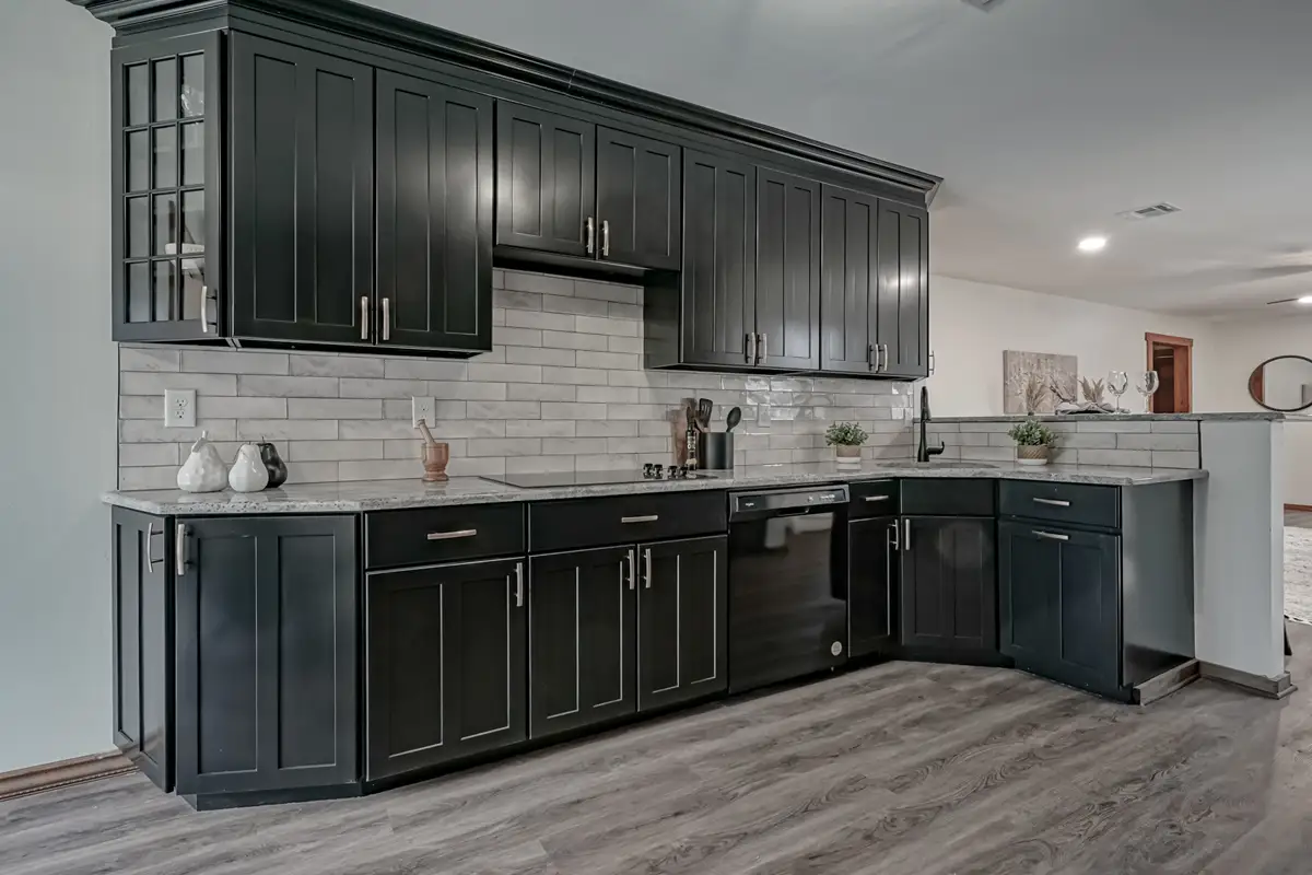 Dark, rich floor to ceiling kitchen cabinetry.