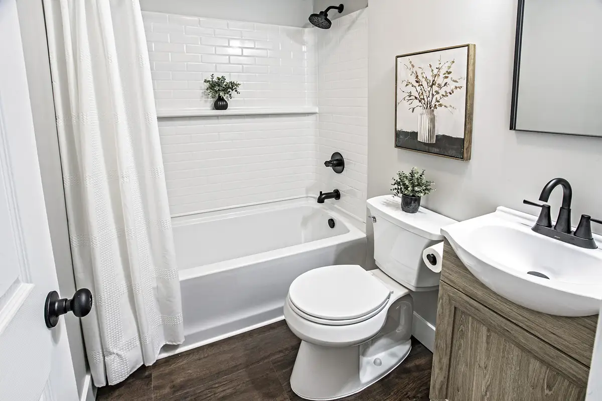 Bathroom with bath and shower.
