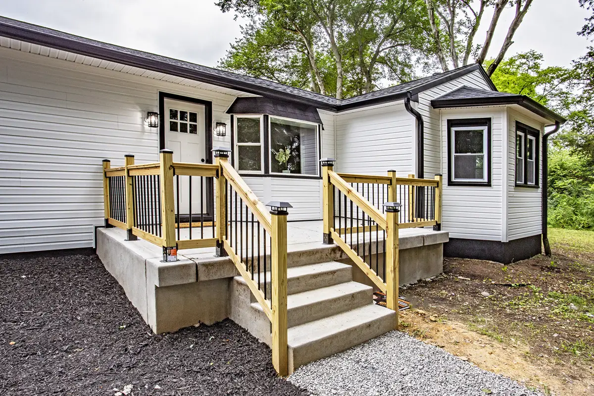 Back of house with raised deck.