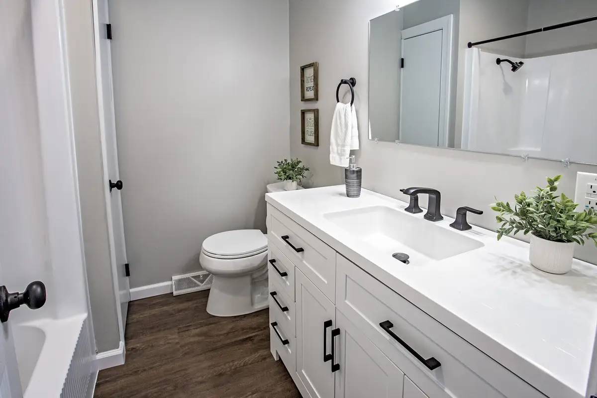 Bathroom with large white vanity.