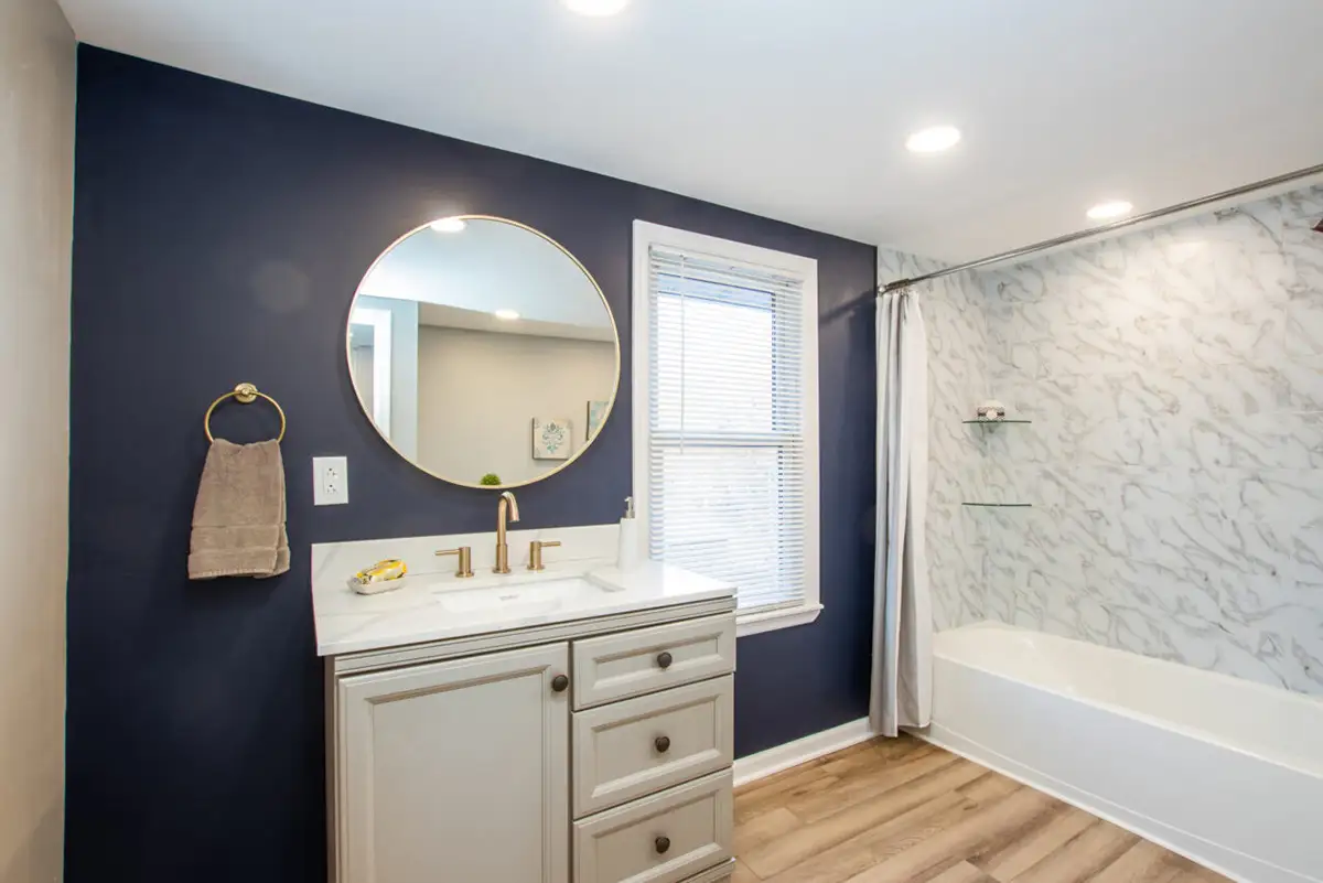 Bathroom with dark accent wall.