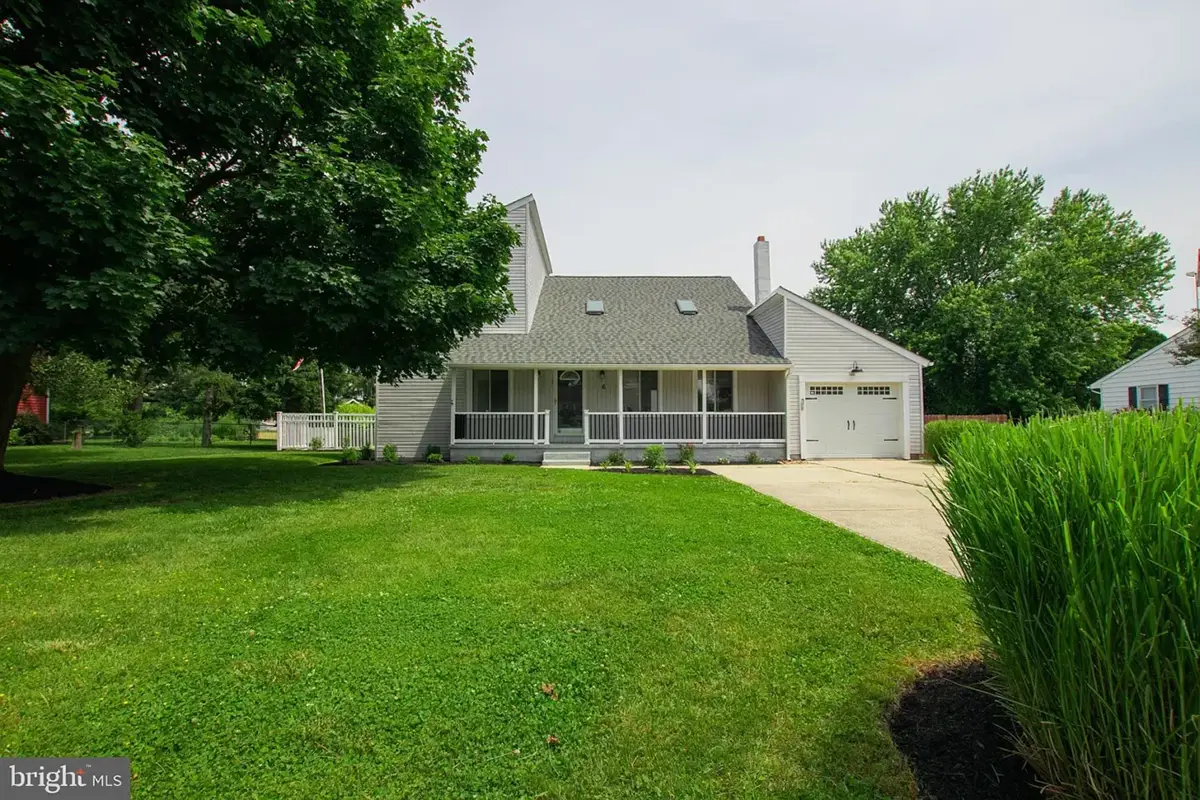 Multi section house with large open porch.
