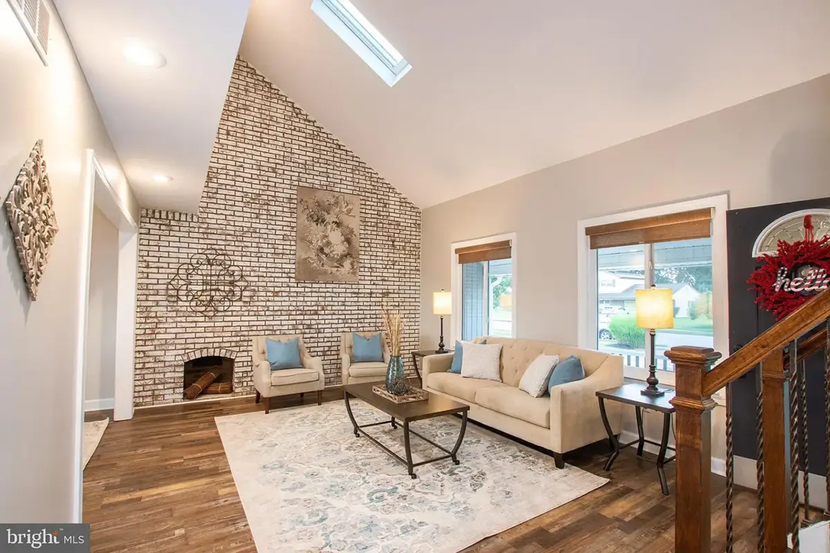 7-1 Living area with large accent wall and vaulted ceiling