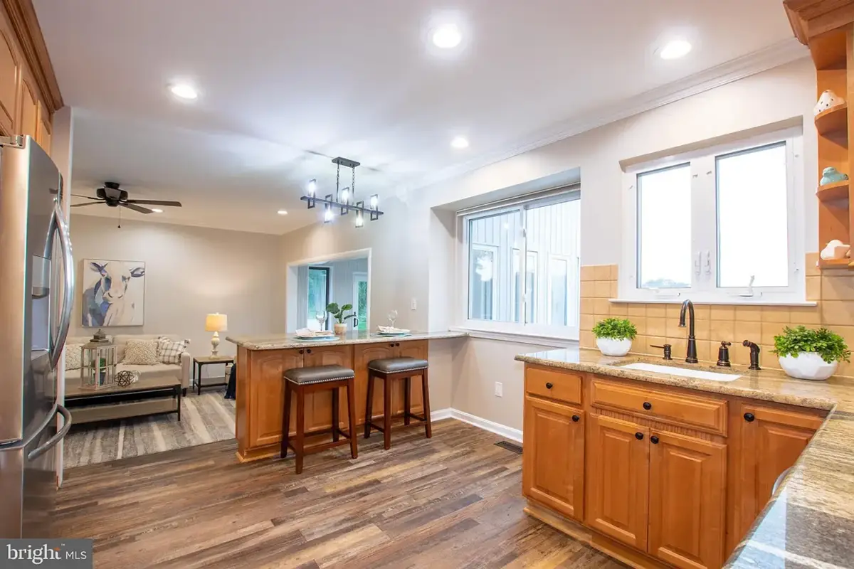 Kitchen breakfast bar and cabinets in rich wood.