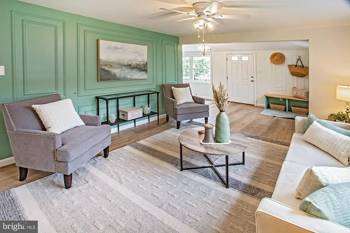 Living area with green accent wall.