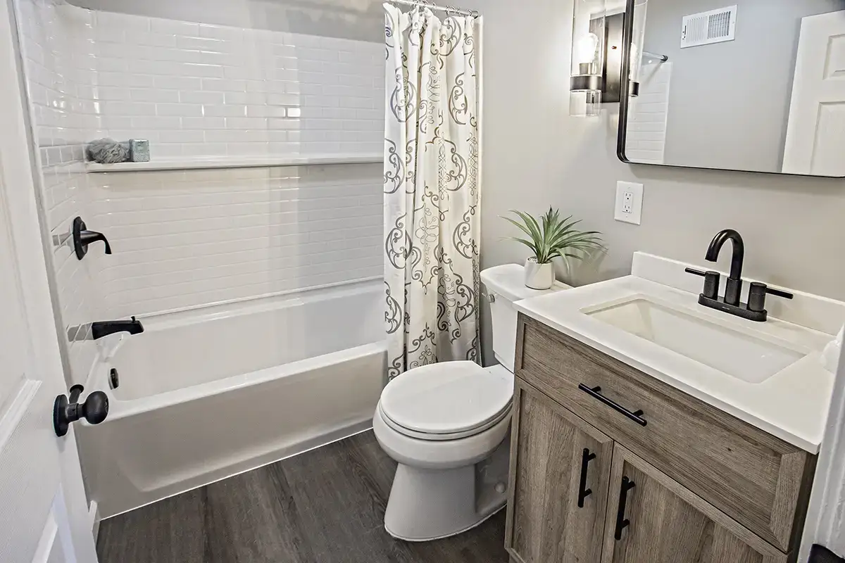 8 Maplewood bathroom with bathtub and shower.