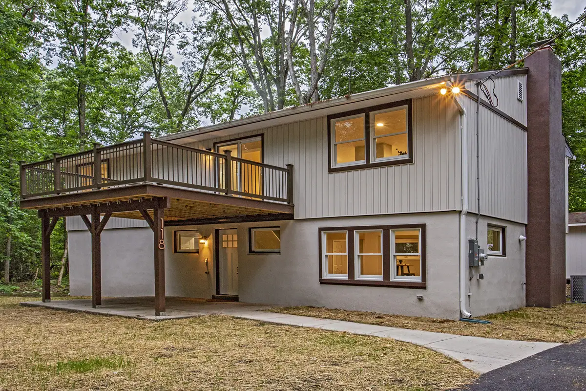 Front of house with lights on.