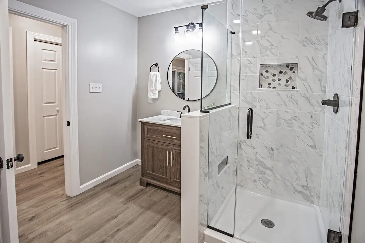 Bathroom with all glass shower stall.
